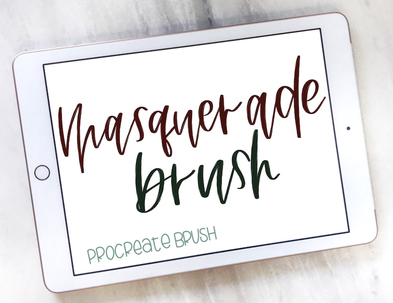 May include: A white tablet screen displaying the text "Masquerade brush" in a dark red and dark green font. The text "Procreate Brush" is displayed in a light green font at the bottom of the screen.