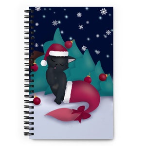 May include: A black cat wearing a Santa hat and a red mermaid tail with a bow sits in front of a green Christmas tree against a dark blue background with white snowflakes.
