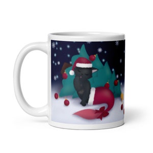 May include: White ceramic mug with a black cat wearing a Santa hat and a red tail fin. The cat is sitting in front of a green Christmas tree with red ornaments against a dark blue background with white snowflakes.