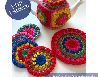 May include: A colorful, crocheted tea cozy and matching coasters. The tea cozy is red, pink, yellow, and green. The coasters are round and feature a similar color palette. The image includes the text "PDF Pattern" and "@little.fig.handmade".