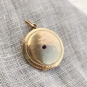 Antique edwardian gold plated locket and dark pink paste stone