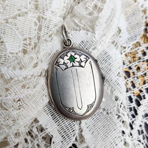 Antique Edwardian silver locket with green glass stone, flower motif locket