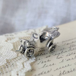 Small silver pendant antique car