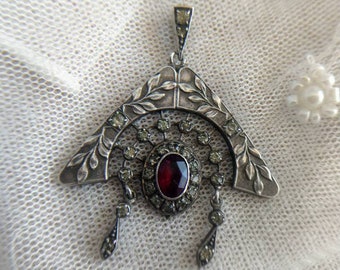 Art Nouveau silver pendant with red paste stone