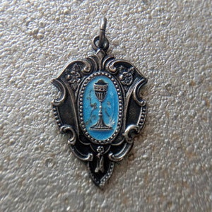 Antique silver communion pendant with blue enamel