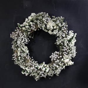 Dried wreath with baby breath, silver brunia, white statice, and German statice