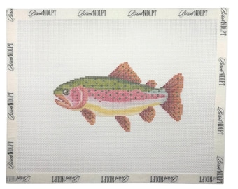 May include: A rectangular needlepoint canvas featuring a centered rainbow trout design with green, pink, and yellow scales. The white mesh canvas has a border printed with the repeating text Birch NDLPT along all four edges of the fabric.