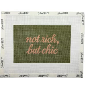 May include: A rectangular needlepoint canvas featuring an olive green background with the text "not rich, but chic" in a light pink cursive font. The canvas has a white border printed with the repeating brand name "Birch NDLPT" along all edges.