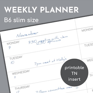 May include: A B6 slim size weekly planner printable TN insert with white paper and black grid lines. The page features printed days of the week and dates with handwritten blue ink notes for November, including a 9:30 meeting, 12:30 opticians, and 7pm meet at Holly's.
