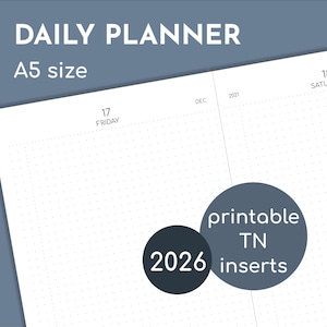 May include: A white A5 size daily planner with a dotted grid. The text "DAILY PLANNER" is at the top, with "A5 size" below it. Two circular graphics read "2026" and "printable TN inserts". The planner shows the dates "17 FRIDAY" and "18 SATURDAY".