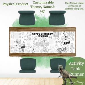May include: A rectangular activity table runner with a wooden frame, featuring a black and white dinosaur theme with the text "HAPPY BIRTHDAY JAWANN" and "JURASSIC PARK". Includes four green chairs. The runner is designed for coloring and activities.