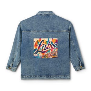 May include: A blue denim jacket featuring a rectangular graphic on the back. The graphic displays the word Lisboa in a stylized script font, overlaid on a colorful, abstract watercolor-style illustration of a cityscape with a yellow tram.