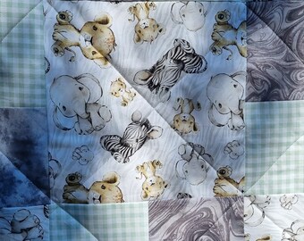 Jungle babies with tones of grey and green, baby cot quilt