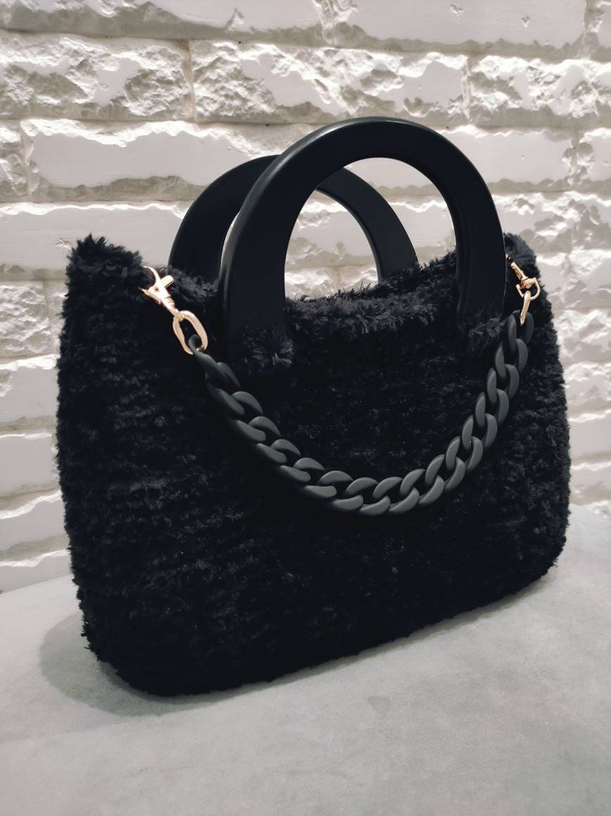 fluffy black handbag