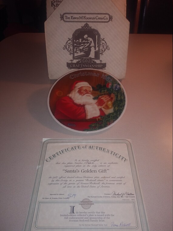 Santa's golden gift by Norman Rockwell 1987 # 11766 E. In original box with certificate of authenticity. Edwin M. Knowles China.
