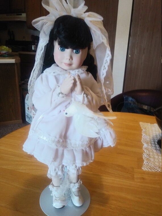 Porcelain Doll #207 with white dress dove and lace Vail Circa. 1980s with stand