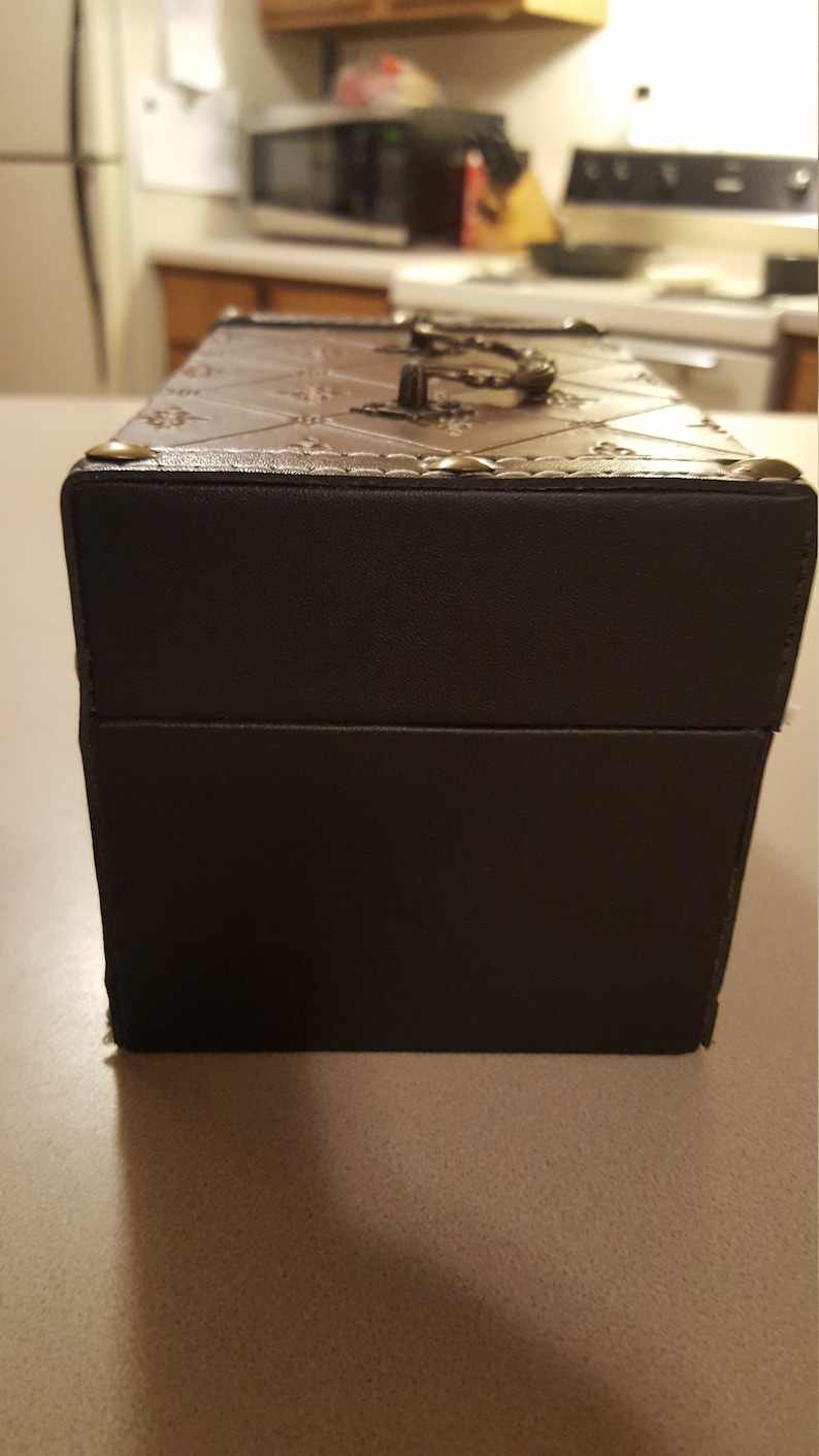 Wooden leather wrapped keep sake box or jewelry box with brass hing treasure chest.