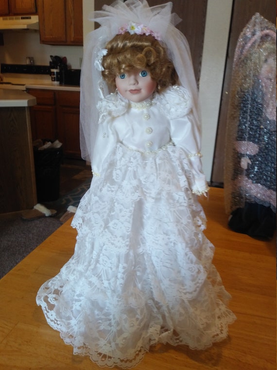 Porcelain Doll #128 Wedding dress circa. 1980s with metal stand.