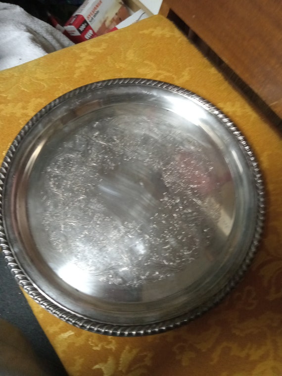 Silver platter with ornate etching