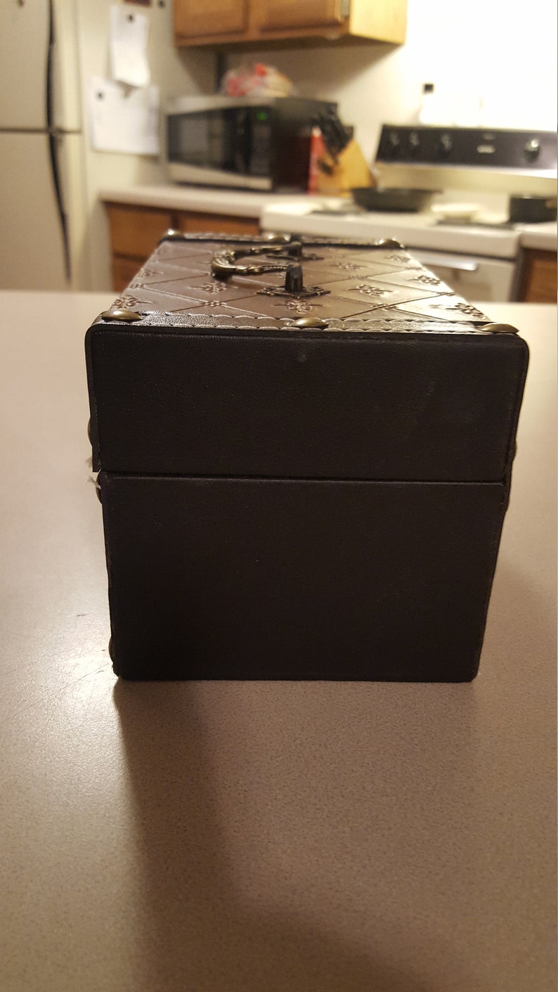 Wooden leather wrapped keep sake box or jewelry box with brass hing treasure chest.