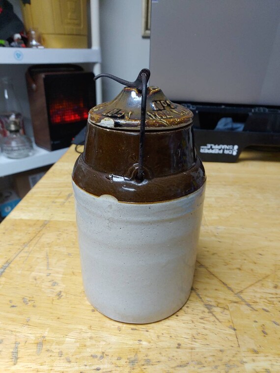 Stoneware salt glazed locking jar with lid embossed with date Circa. 1891