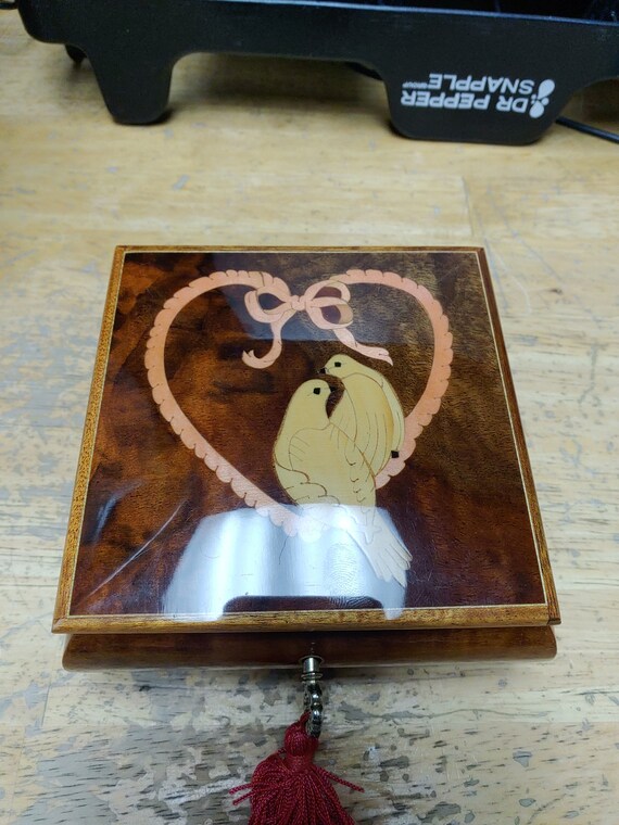 Inlaid walnut musical with Swiss made mechanism