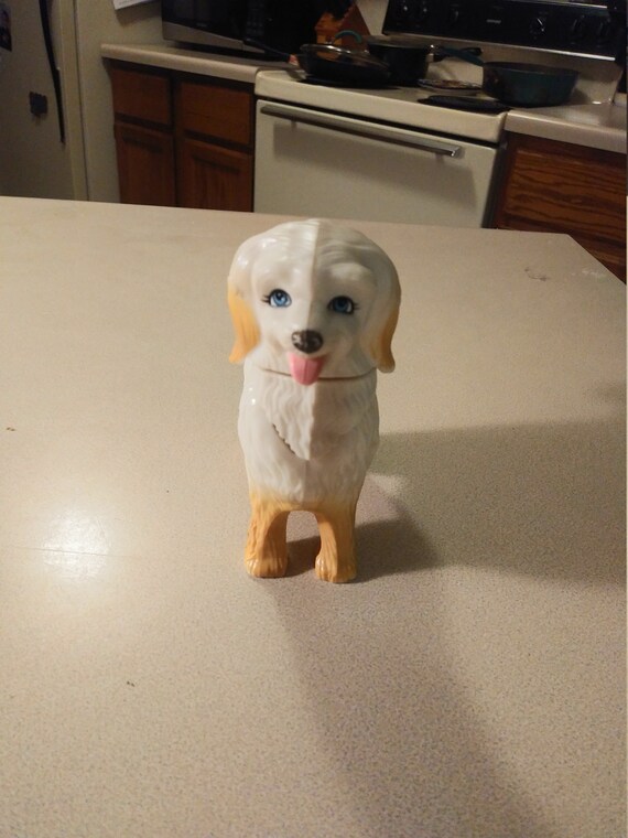 Toy dog move his tale his head bobs up and down. Circa. 1980s