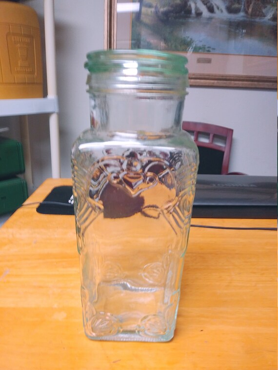 Embossed green glass canister with glass lid made in Italy Circa. 1980s