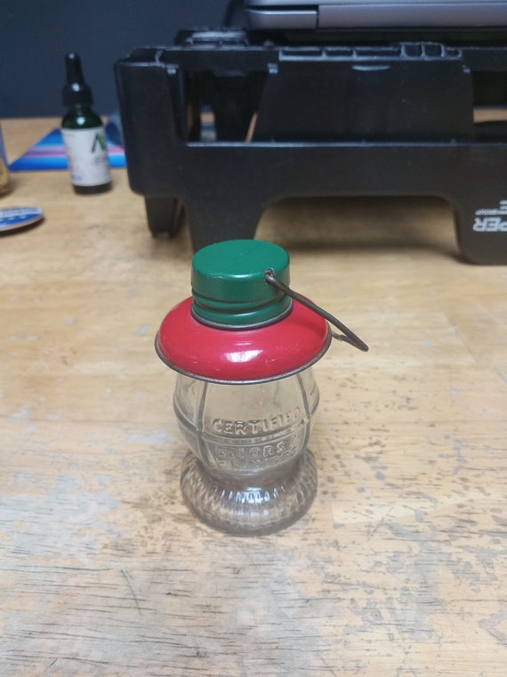 Miniature glass lantern that held candy