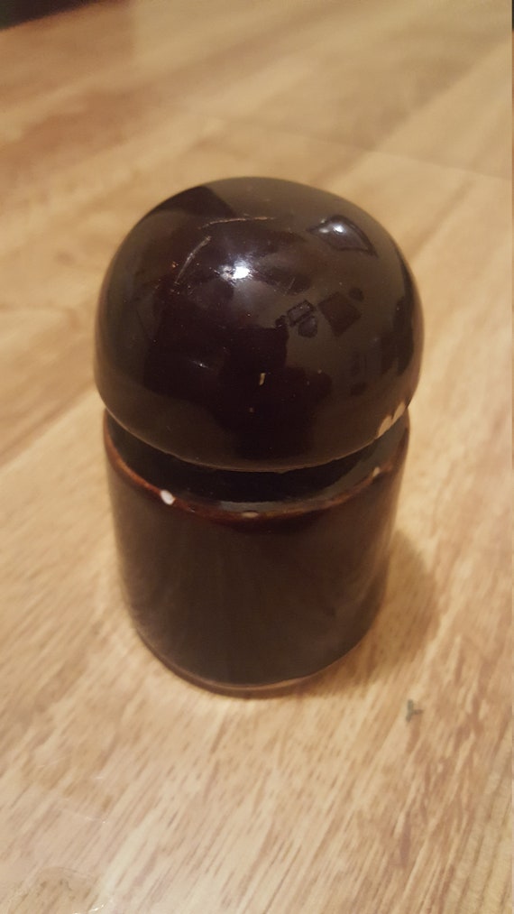 Stoneware insulator in great condition shaped like a bullet head