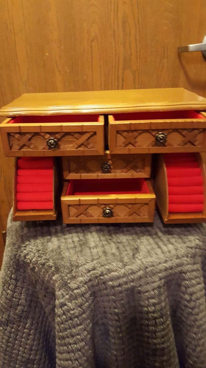6 drawer wooden Jewelry Box with red felt inserts.