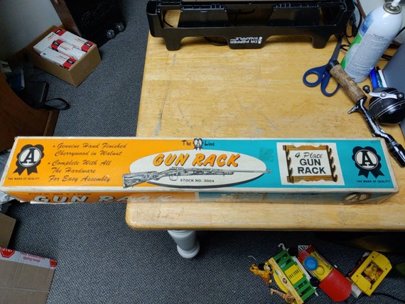 The A line 4 place Gun Rack in original box. Stock NO. 3004 Circa. 1950s
