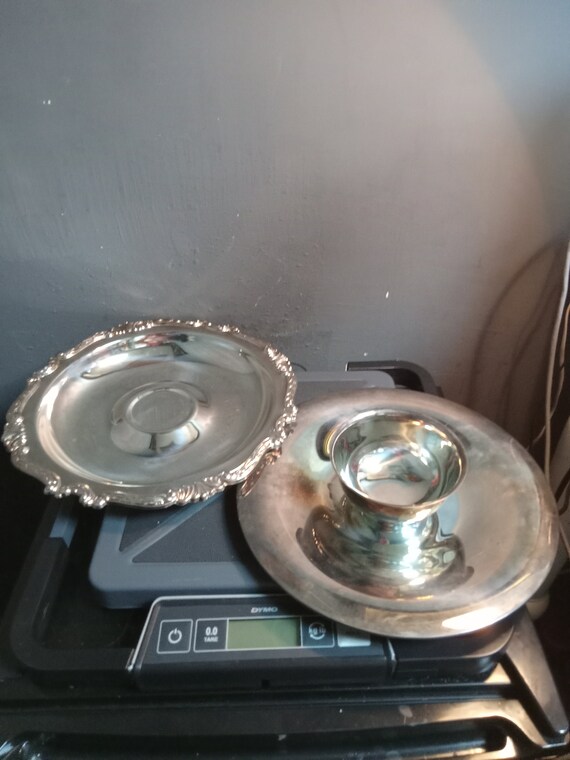 Two stainless steel serving trays