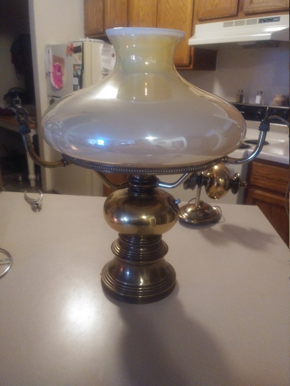 Hanging Solid brass parlor lamp with Butterscotch globe Circa. 1960s