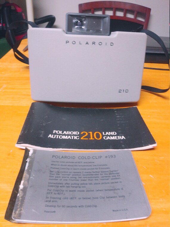 Polaroid 210 Automatic Land Camera with owners manual and cooling film plates. Circa. 1967
