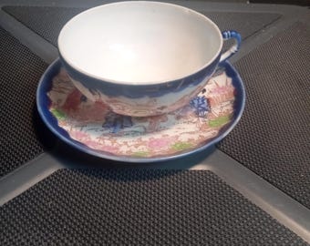 Nipping tea cup and saucer with Geisha Girls