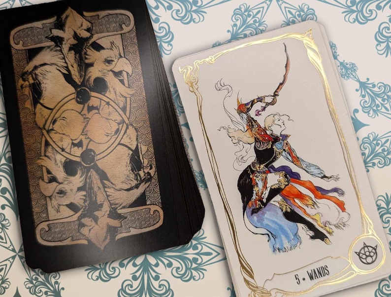 May include: A tarot card with a gold border and a white background. The card depicts a person in a black and white outfit holding a staff. The card is labeled "5 - Wands".