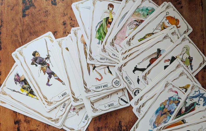 May include: A spread of tarot cards with illustrations of people and symbols. The cards are white with gold trim and feature a variety of suits, including wands, swords, and cups. The cards are arranged in a fan shape, with the top card showing a knight riding a horse.