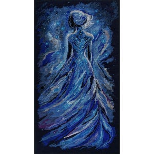May include: A cross-stitch embroidery piece depicting a figure viewed from behind, wearing a flowing gown in shades of deep blue, navy, and white. The design features a celestial, starry background with swirling light patterns surrounding the figure.