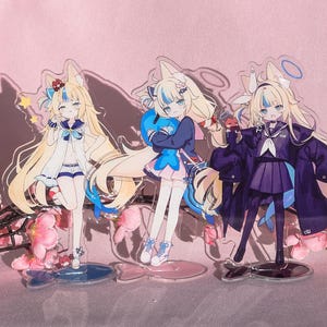 May include: Three acrylic anime character figures with long blonde hair and blue accents. The figures are dressed in various outfits, including a sailor-style uniform and a dark purple coat. Each figure stands on a clear base, with a pink background and cherry blossoms.