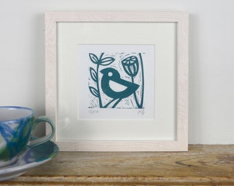 Framed lino print "Little Blue Bird" handmade by artist Melissa Birch