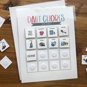 May include: A white printable chore chart with the title "Daily Chores" and the name "Ericka" printed at the top. The chart is divided into two sections: "To Do" and "Done". Each section has a grid of 6 squares with different chores illustrated in each square. The chores include: "Do Something Nice", "Clean Windows", "Brush Teeth", "Vacuum", "Fold Clothes", "Dry Dishes", "Get Mail", "Set Table", "Water Plants", "Put Clothes Away", "Mop", and "Wipe Leans".