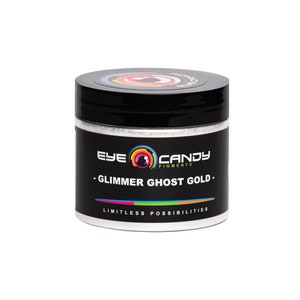 May include: A white jar with a black lid and a label that says "Eye Candy Pigments - Glimmer Ghost Gold - Limitless Possibilities".