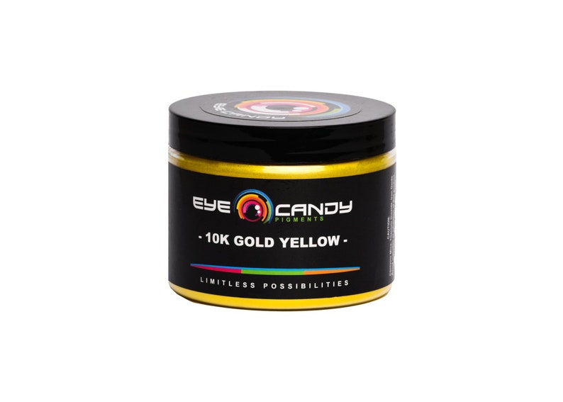 May include: A jar of 10K Gold Yellow pigment by Eye Candy Pigments. The jar is gold with black lettering and a logo of a colorful eye with the words "Eye Candy Pigments". The text on the jar reads "10K Gold Yellow" and "Limitless Possibilities".