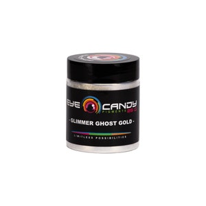 May include: A silver jar of Eye Candy Pigments 25g Glimmer Ghost Gold. The jar has a black lid and a rainbow eye logo.