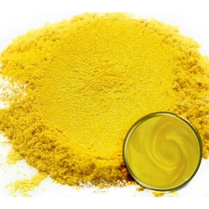 May include: A pile of bright yellow mica powder with a small sample jar of the powder.