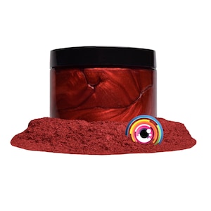 May include: A jar of red metallic pigment powder. The powder is a deep red color with a metallic sheen. The jar is made of clear plastic and has a black lid.