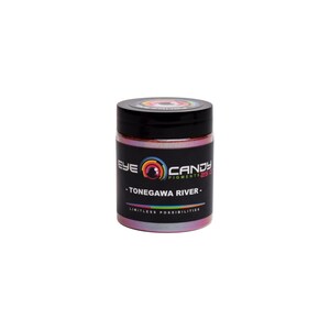 May include: A jar of Eye Candy Pigments in a pearlescent pink hue, with a black lid. The label features the text "EYE CANDY PIGMENTS" and "-TONEGAWA RIVER-". The jar is set against a white background.
