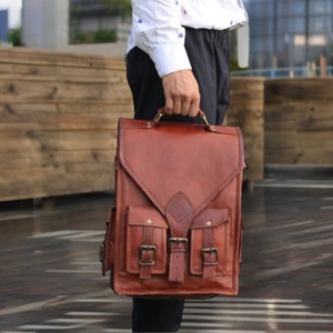 The convertible backpack can be used as a leather briefcase by removing the strap. The perfect size and the top handle makes it easy to carry around.  Get into the office and client meetings with a sleek style messenger bag.