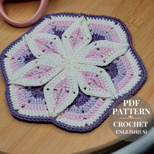 Crochet potholder for the kitchen. Crochet coaster pattern. Hexagonal flower-shaped motif 3D.